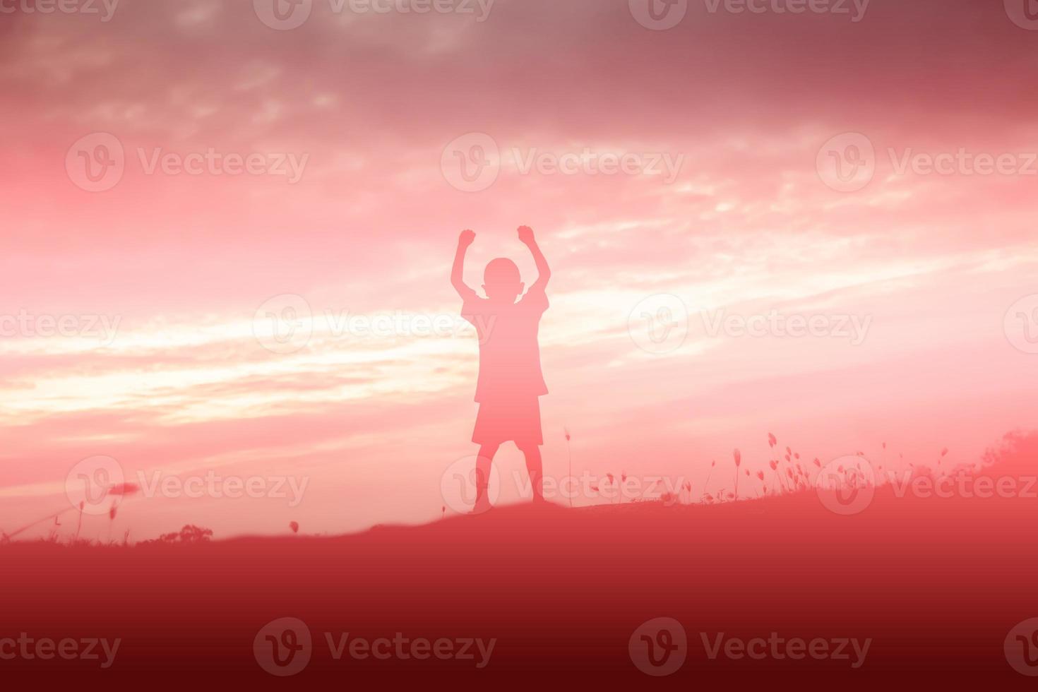 kid silhouette,Moments of the child's joy. On the Nature sunset photo