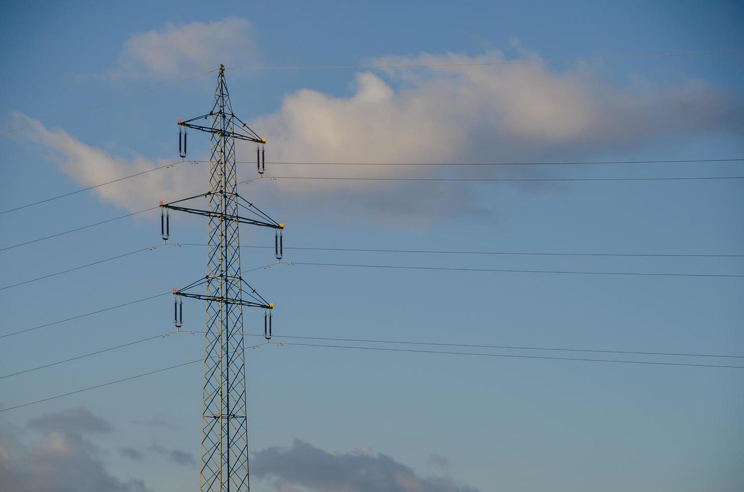 electricity pylon and clouds photo