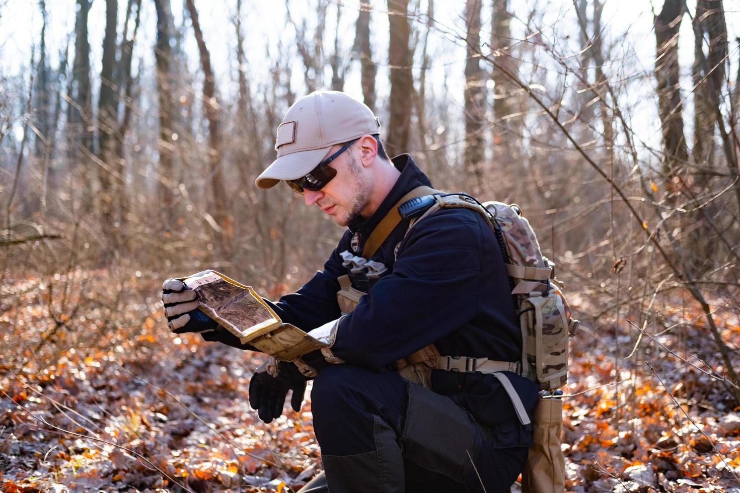 Male from private military company with rifle in the forest photo