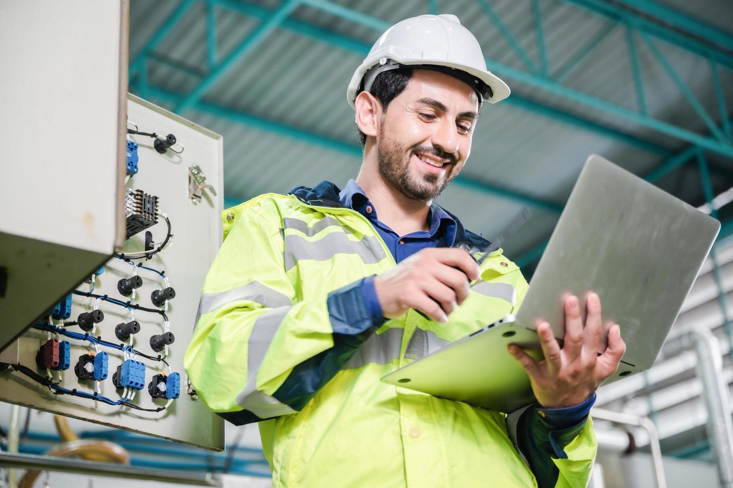 professional technician engineer working to control electrical power and safety service system, electrician working to maintenance and checking industrial equipment in term of factory technology photo