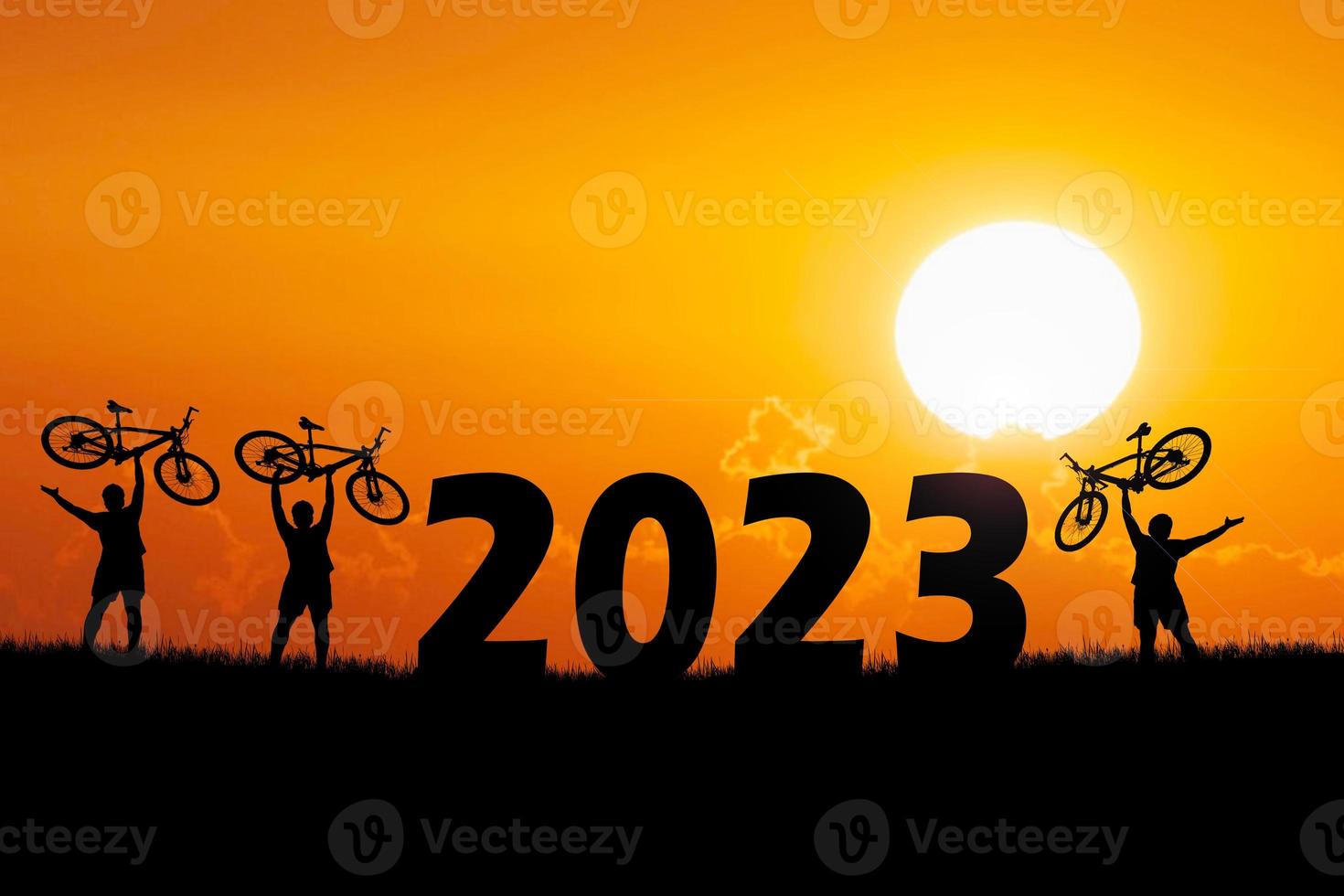 Bicycle adventurous tourists carrying bicycles over obstacles. happy new year 2023 photo