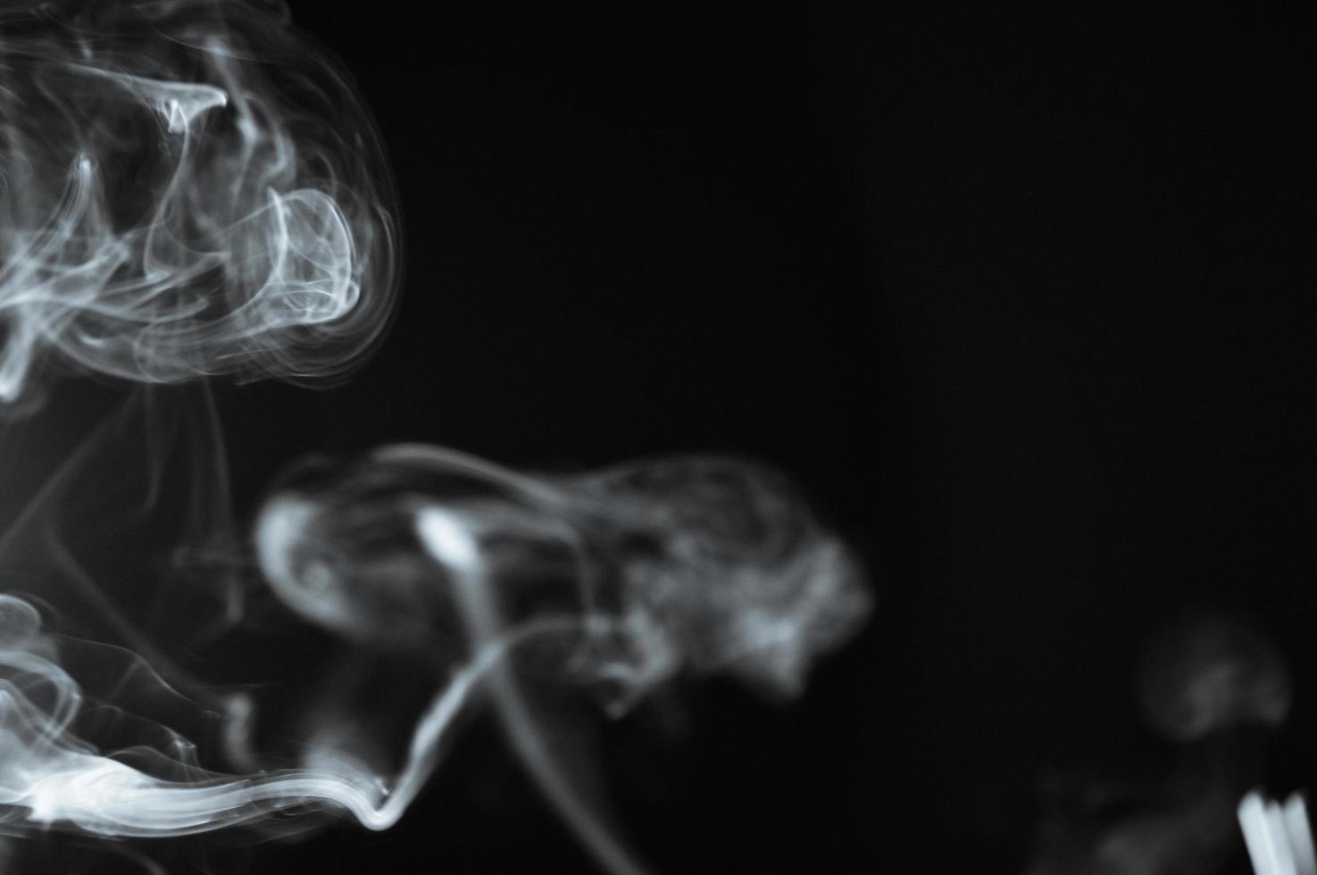 abstract background of smoke or fog on black background photo