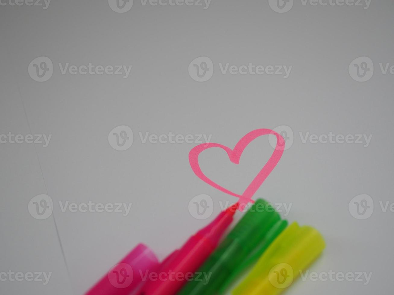 LOVE Pink Green Yellow Pen Maker on white background photo