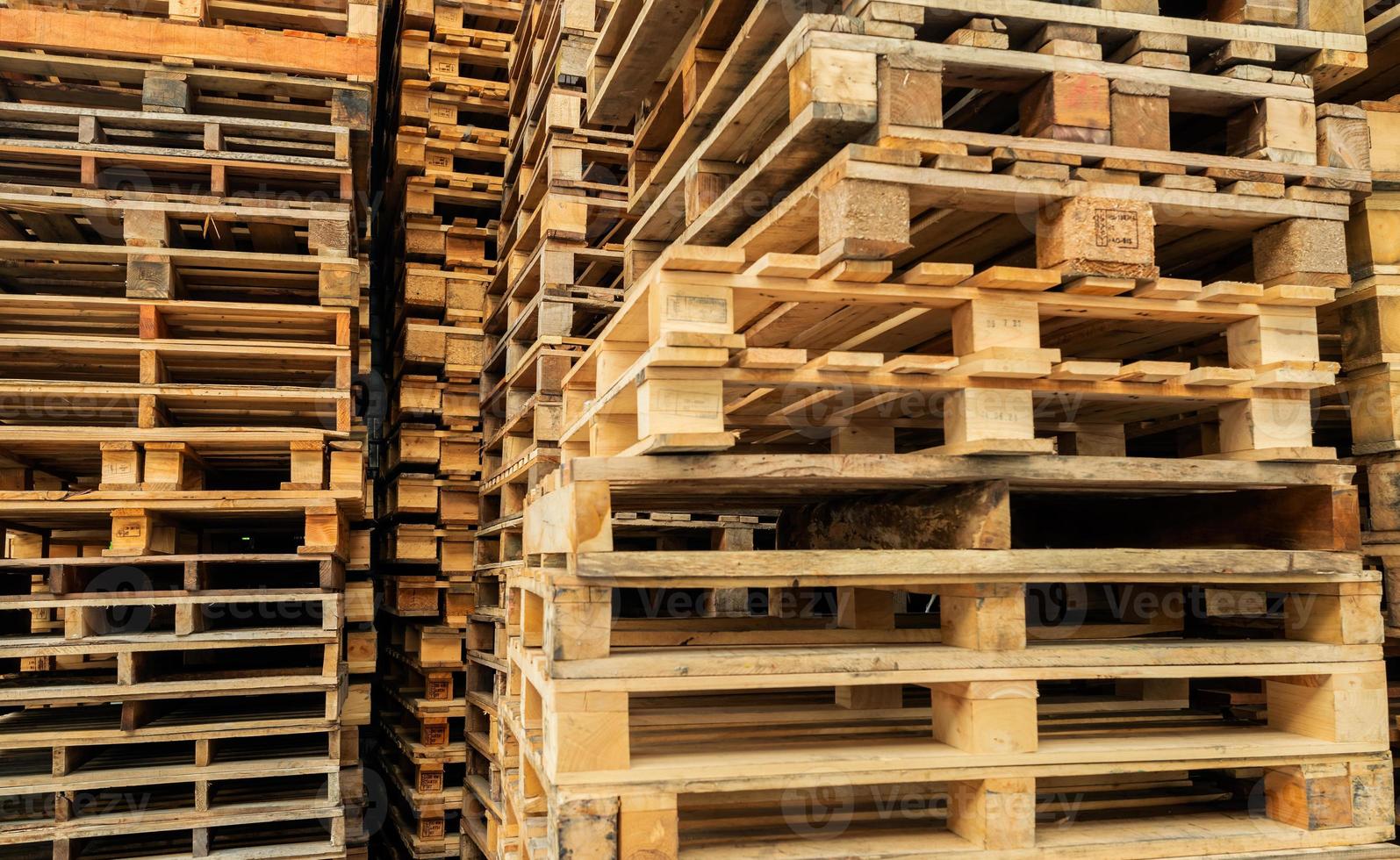 Stack of wooden pallet. Industrial wood pallet at factory warehouse. Cargo and shipping concept. Sustainability of supply chains. Eco-friendly nature and sustainable properties. Renewable wood pallet. photo