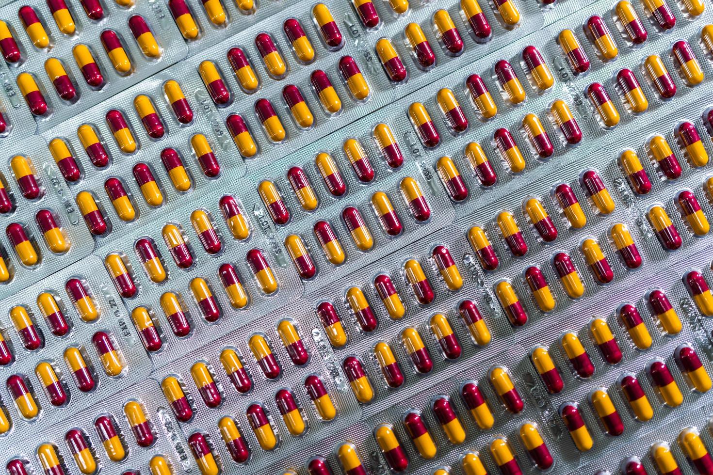 Antibiotic capsule pills in blister pack. Pharmaceutical industry and pharmaceutics concept. Antibiotic drug resistance. Pills packaging. Amoxicillin capsule pills for treatment respiratory infection. photo