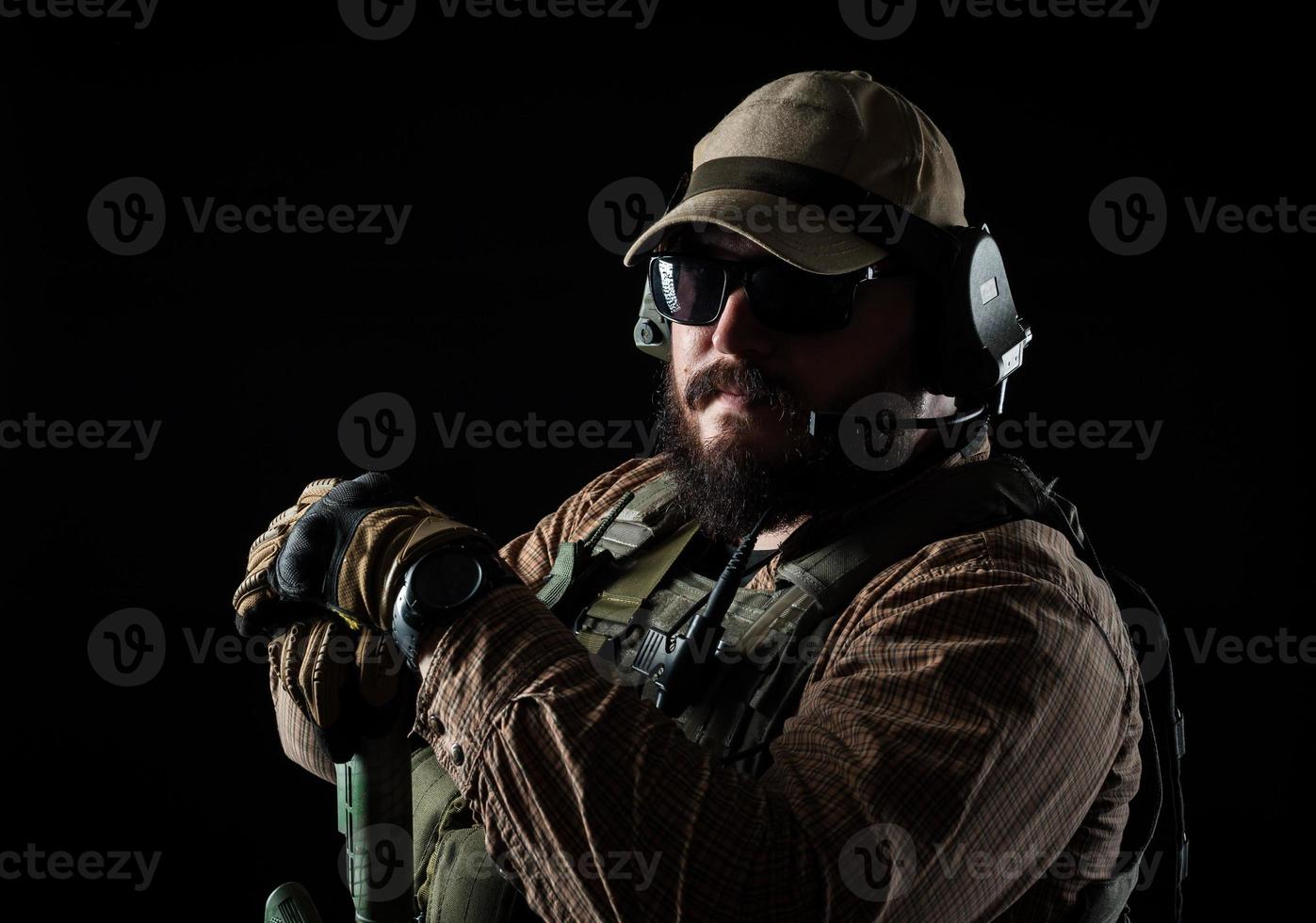 Armed soldier ready for battle. Military concept. photo