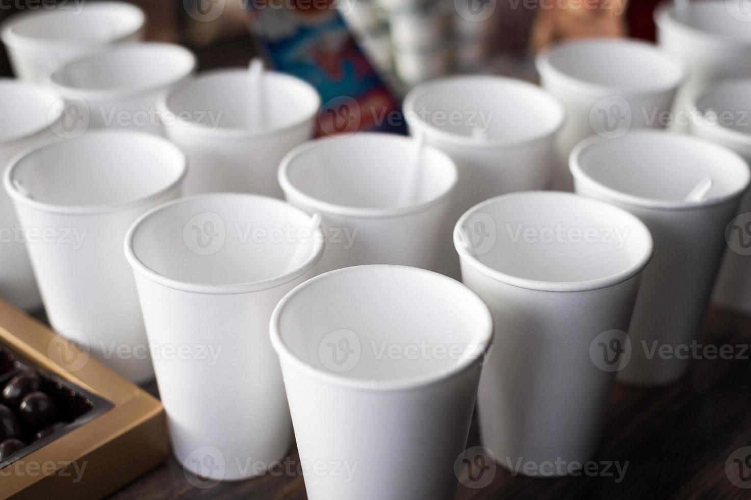 A group of empty coffee cups to serve tea or coffee at an event buffet photo