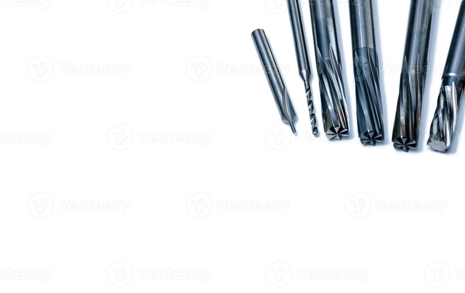 Special tools isolated on white background. Made to order special tools. Coated step drill and reamer detail. HSS cemented carbide. Carbide cutting tool for industrial applications. Engineering tools. photo