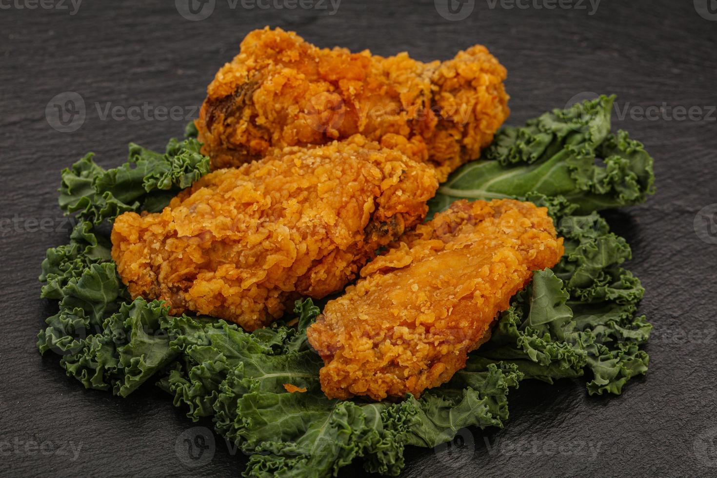 Hot fried crispy chicken wings photo