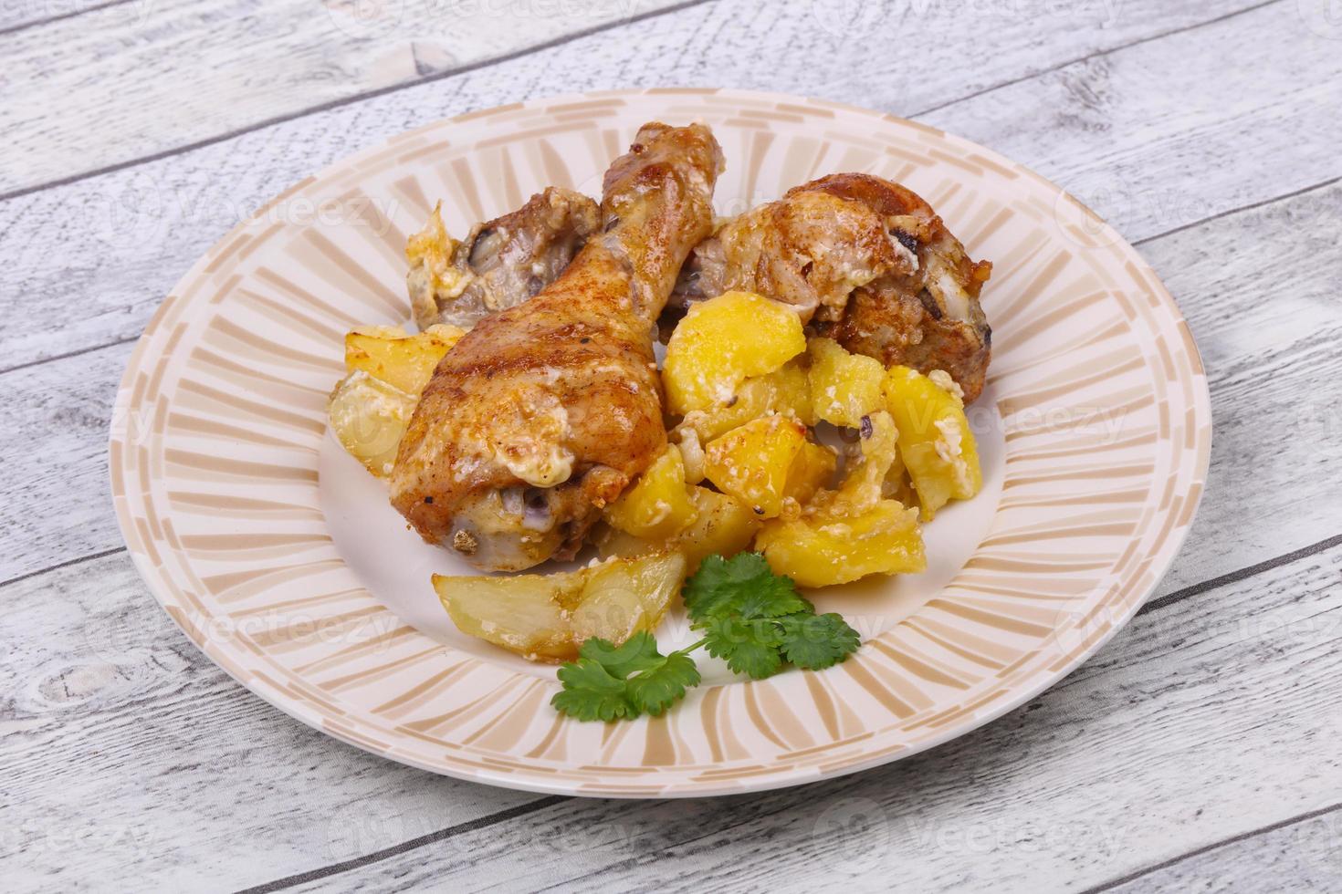 Roasted chicken legs with potato photo