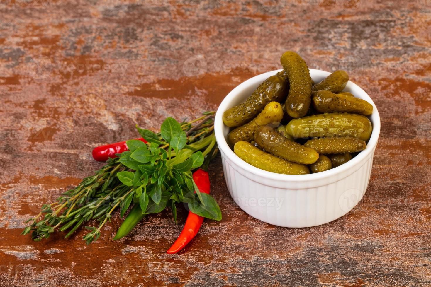 Pickled small cucumbers photo