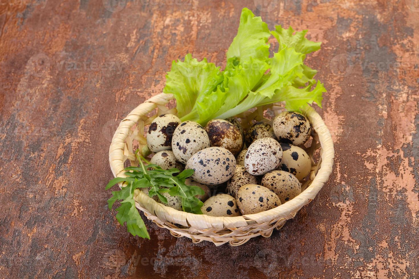 Quail eggs in the basket photo