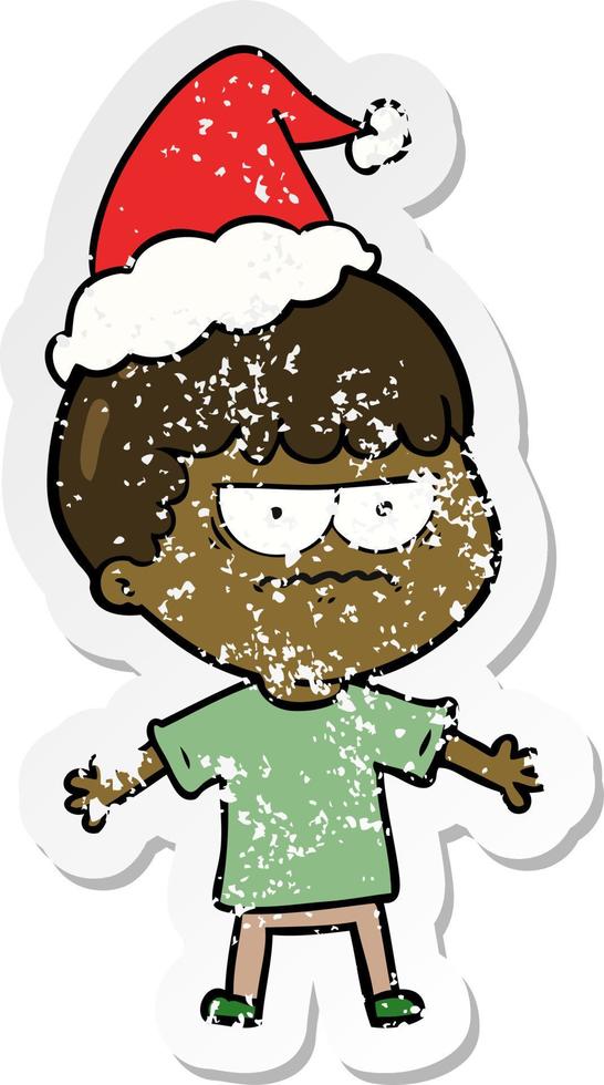 distressed sticker cartoon of a angry man wearing santa hat vector