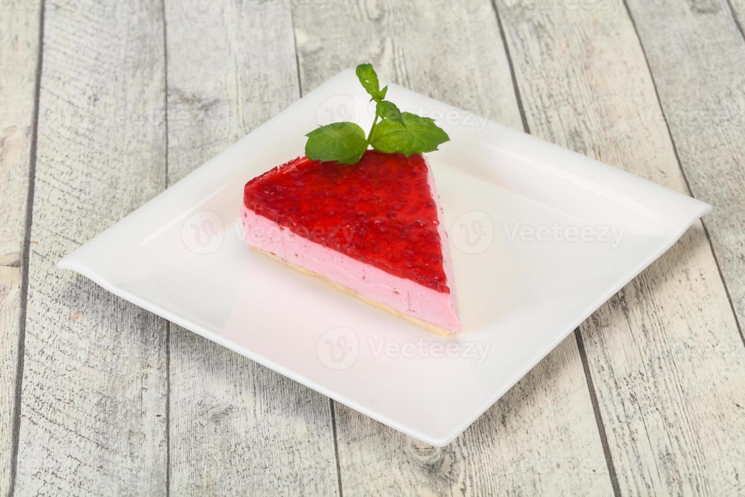 Soft Raspberry cheesecake served mint photo