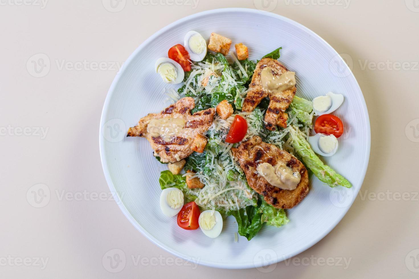 Caesar salad with chicken photo