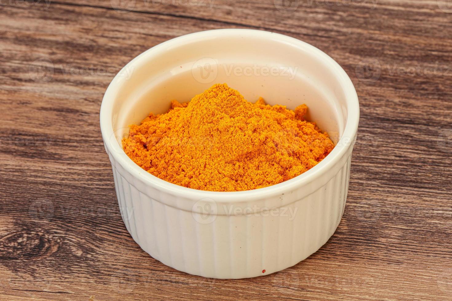 Tumeric powder in the bowl photo
