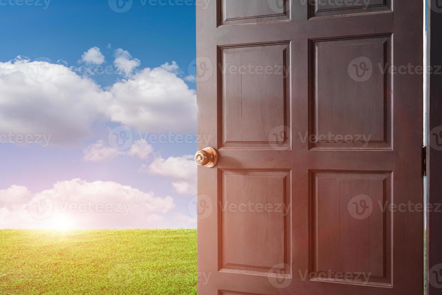 open door with a view of green rice field at sunrise sky background. photo
