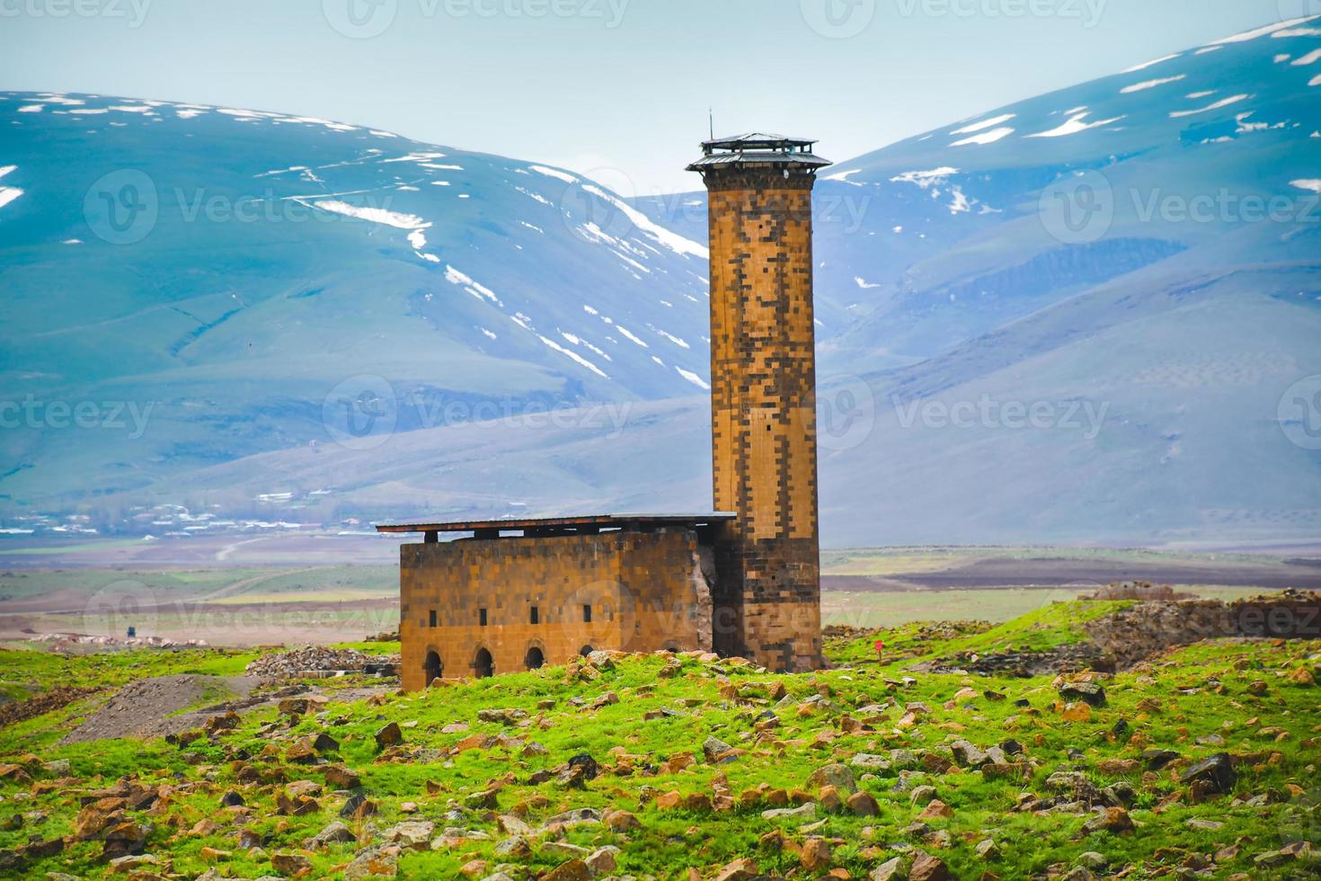 Tower structure with mountains background. Ani ruins archeological site eastern anatolia, Turkey photo