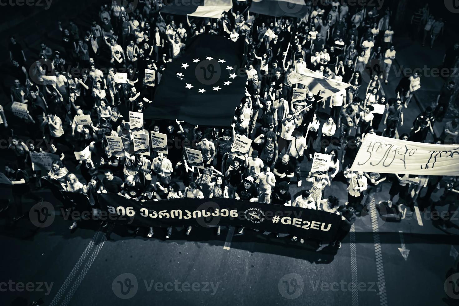 Tbilisi, Georgia , 2022 - Aerial view people march in streets on major EU-pro rally event. Thousands of people on peaceful demonstration event. Pro-Europe rally event in capital city Georgia photo