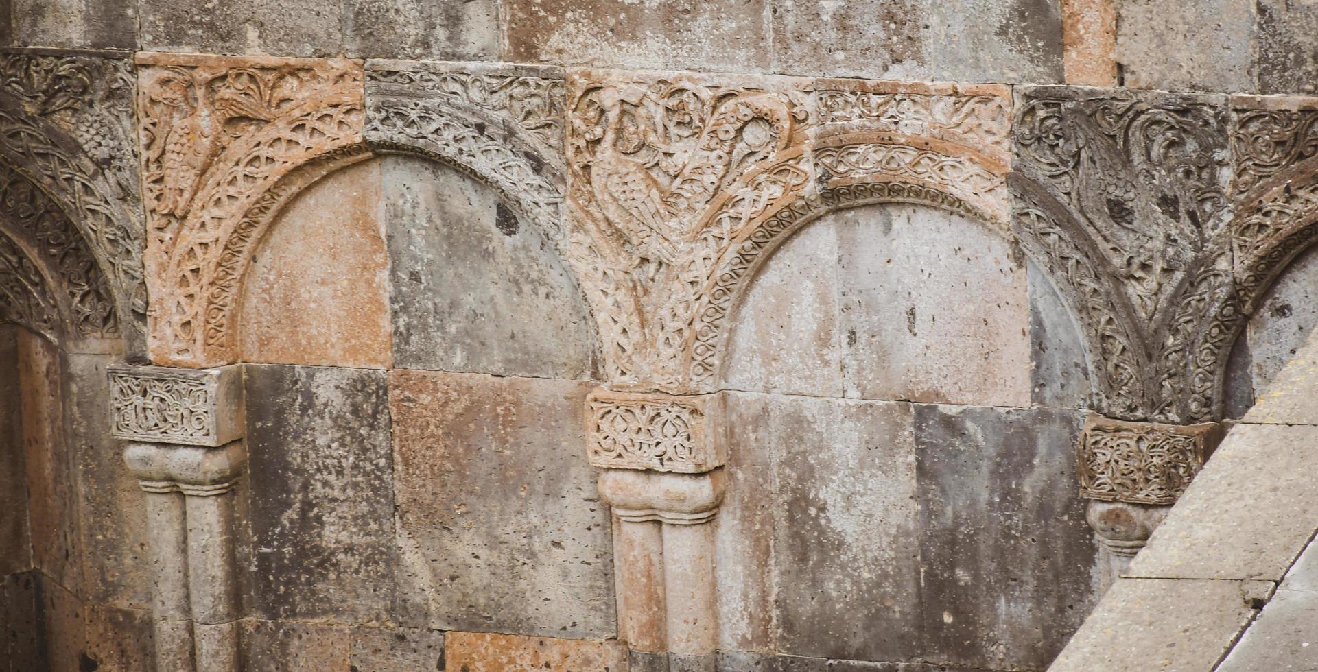 Patterns and signs of animals on old buildings in Ani archeological site in Turkey photo