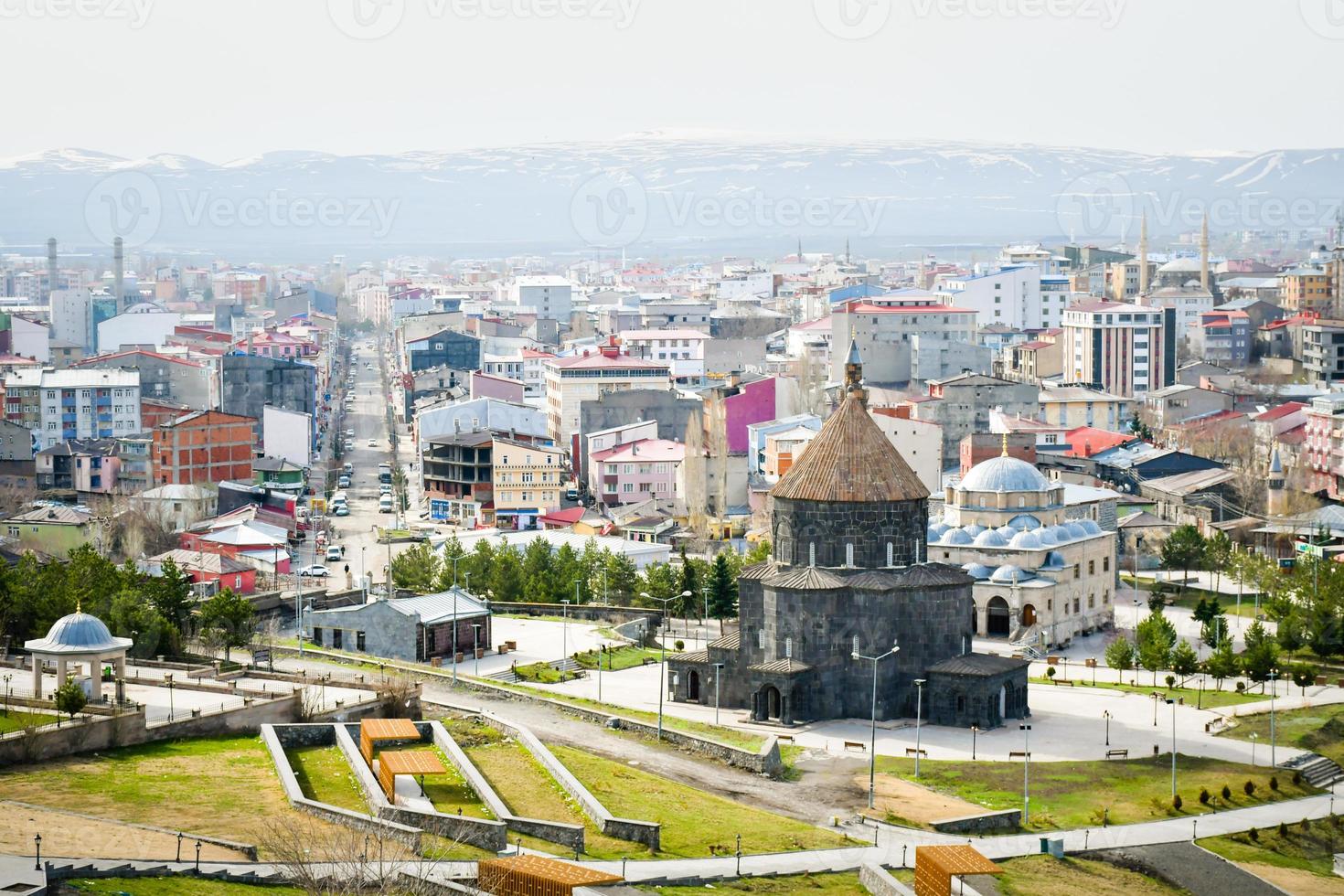 Aerial panning view Kars mosque with city panorama in eastern Turkiye photo