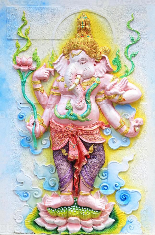 Ganesha sculpture on temple wall photo