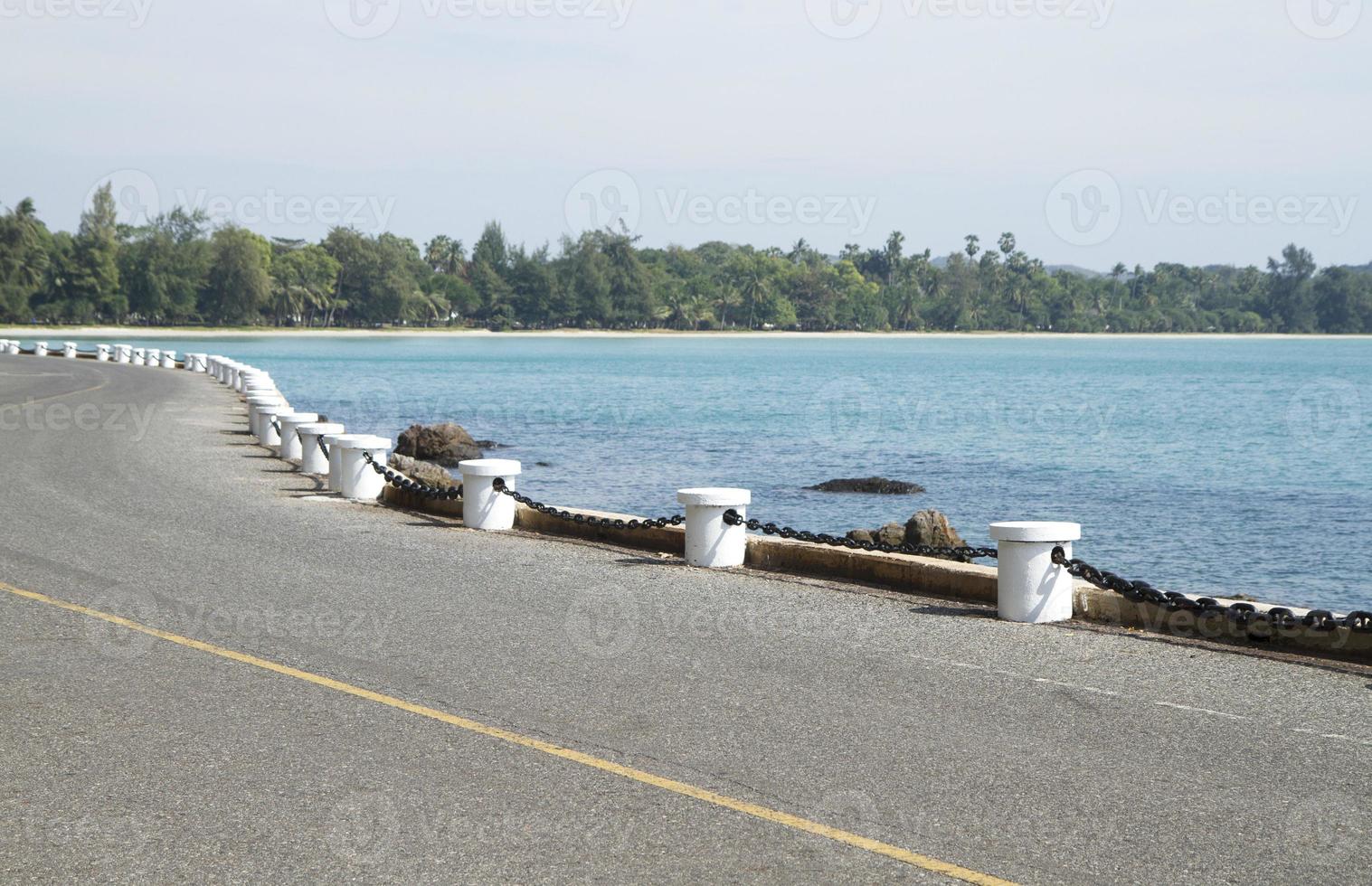 Road side along the beach and blue sea photo