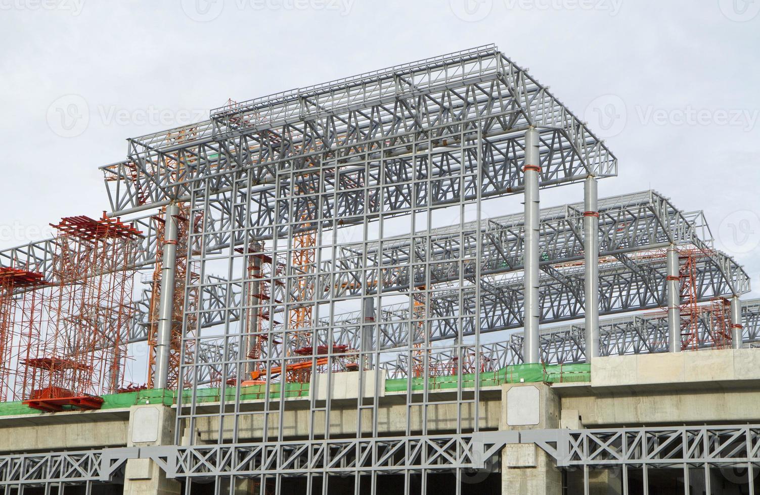 Large construction site with tower crane and blue sky photo