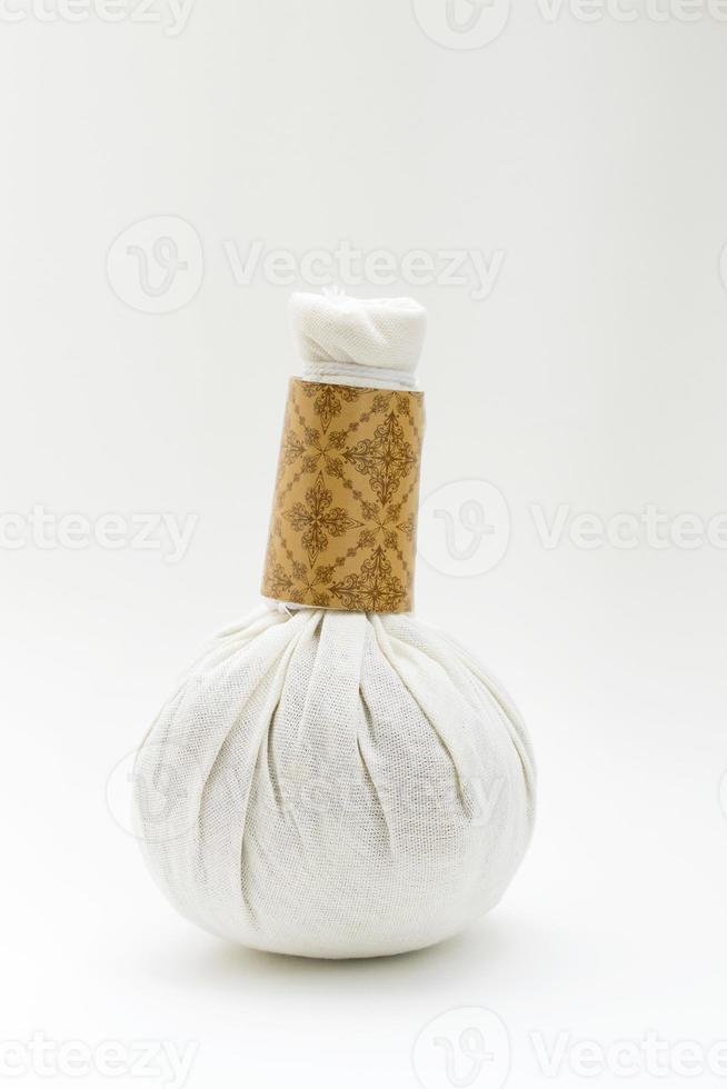 Natural Spa Ingredients herbal compress ball isolate on white background photo