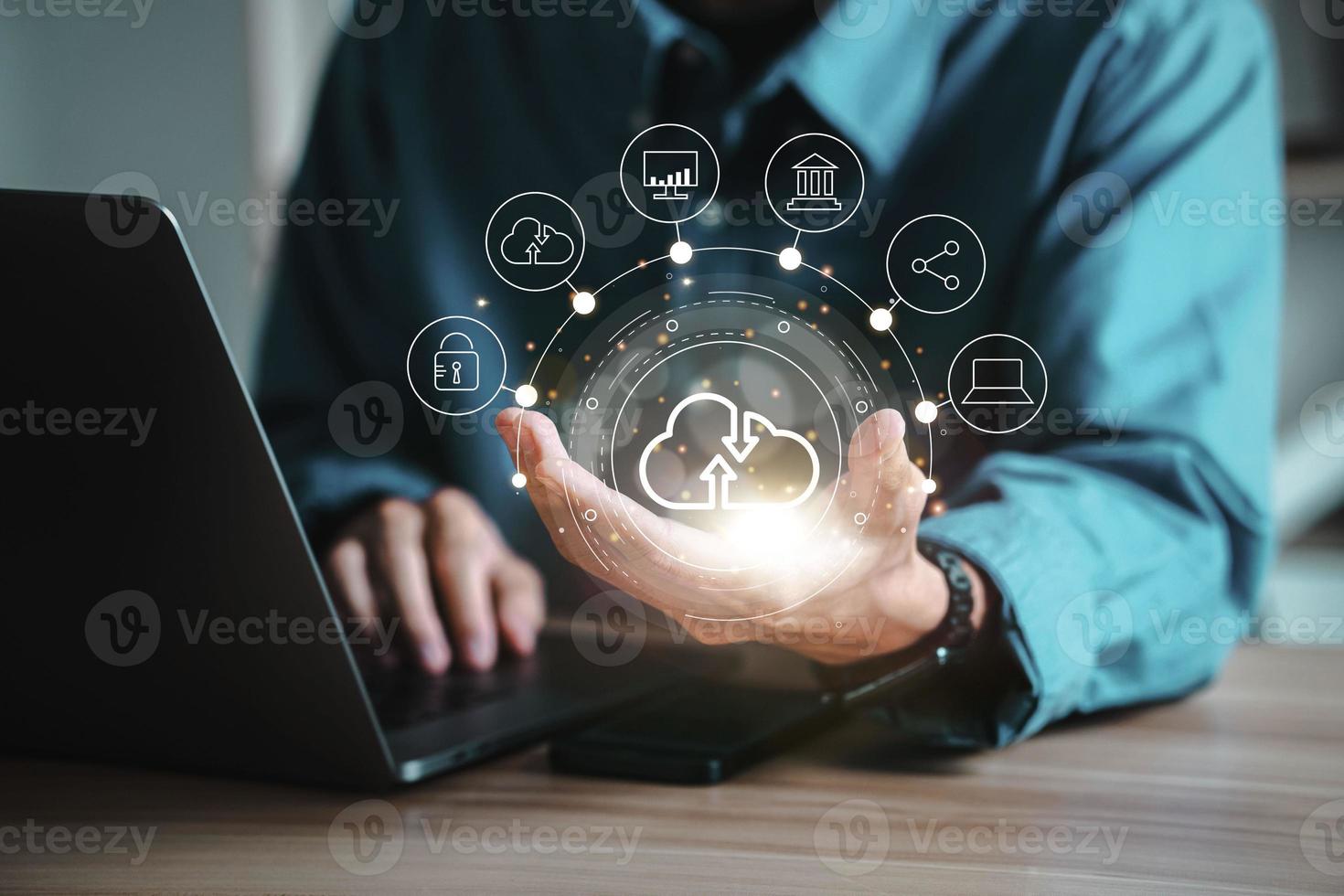 Mobile man shown with cloud computing diagram in hand. cloud technology data storage network and internet service concept photo