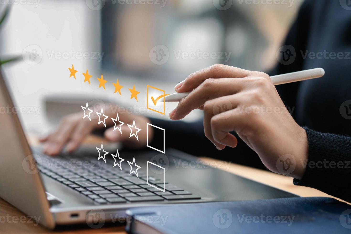 Businessman typing on a computer keyboard, customer service satisfaction survey concept. Business people choose the highest satisfaction rating and give 5 stars. Satisfaction, rating, rating. photo