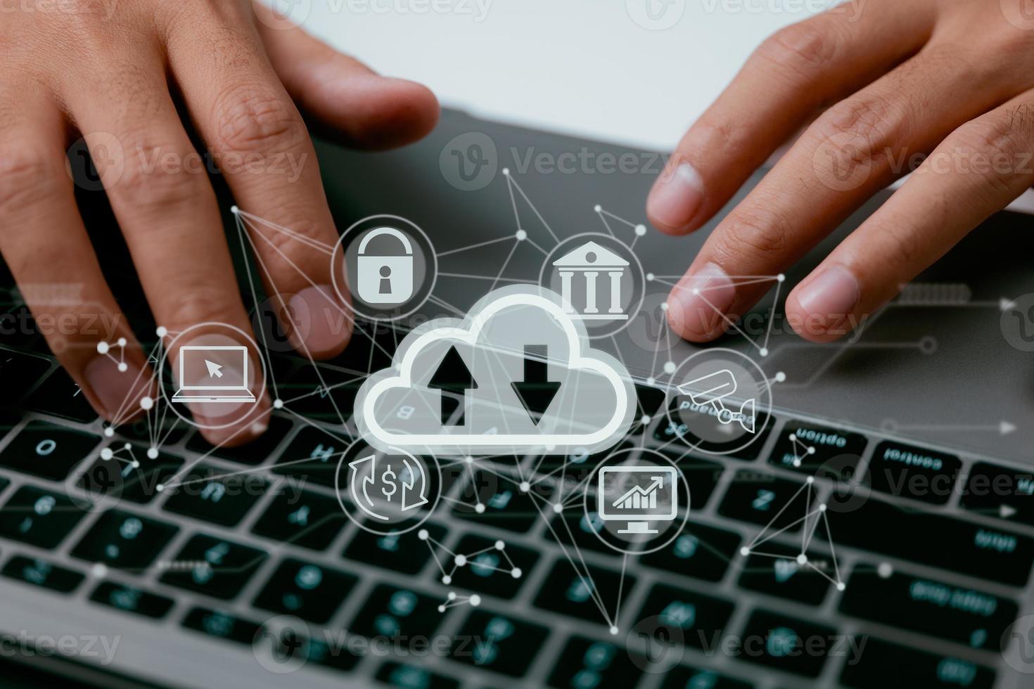 A cloud computing diagram is displayed on a laptop in the hands of a man. Networking and internet service principles for data storage in the cloud. photo