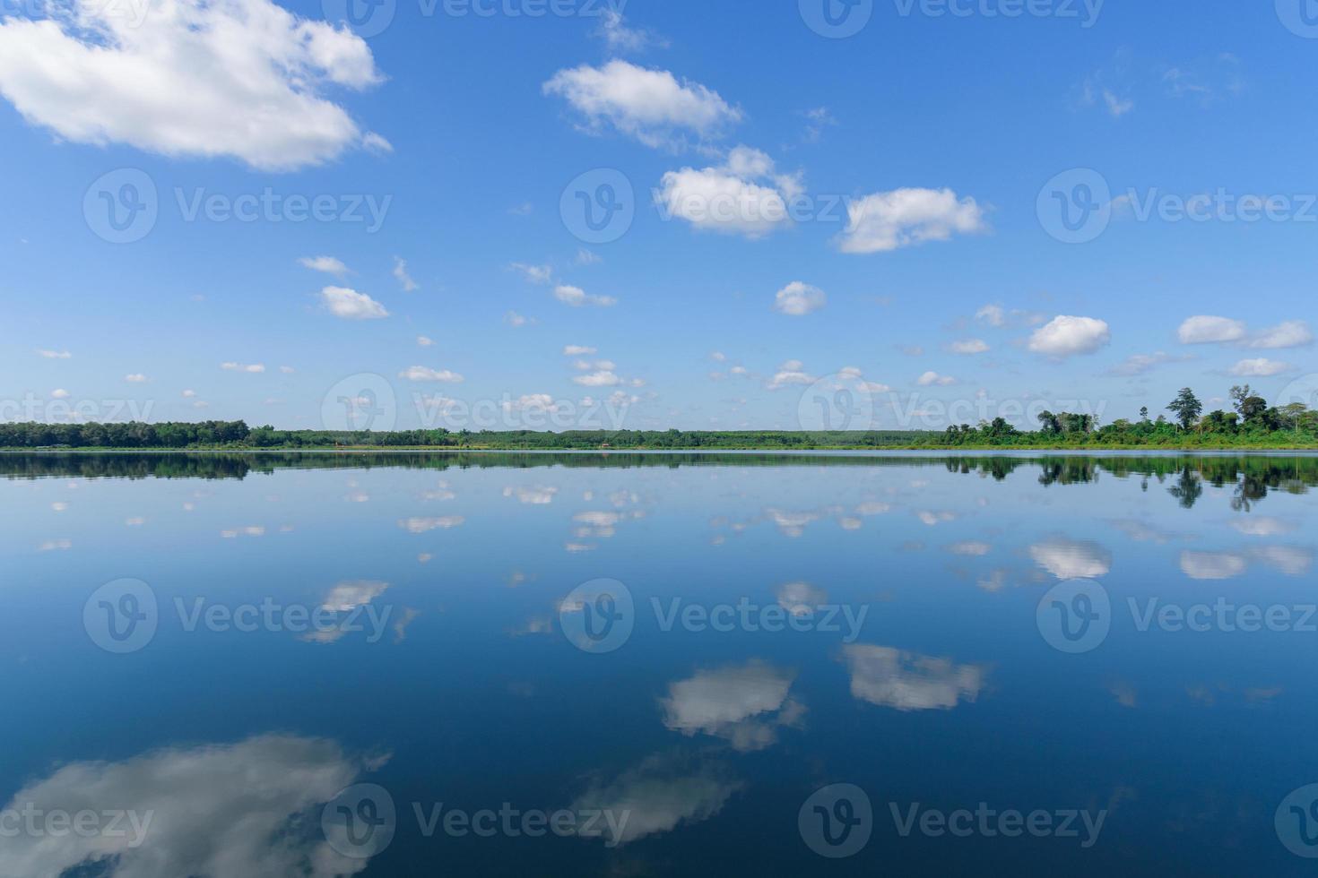 Large island in the lake. There is a beautiful cloud reflecting on the water At  Bueng Kan Province of Thailand 2 photo