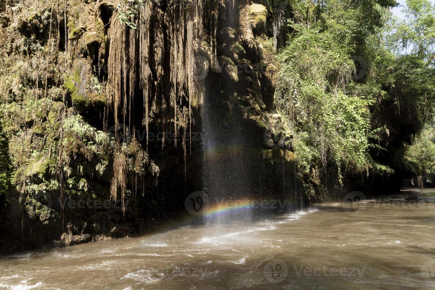 Sai Rung Waterfall at Umphang District, Tak Province, Thailand The reflection of sunlight produces the colors of the rainbow. It is a popular tourist destination. photo