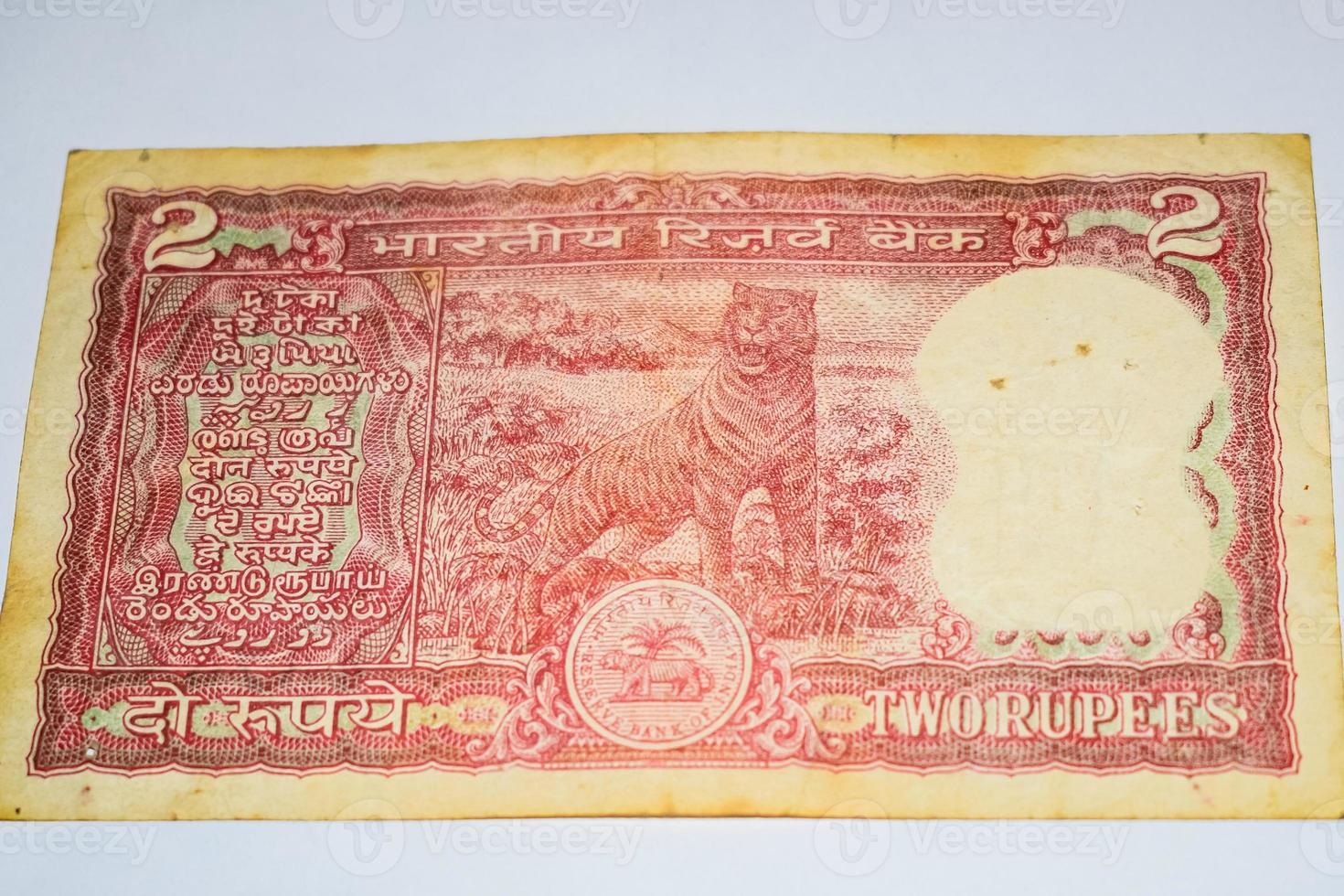 Old Two Rupee notes combined on the table, India money on the rotating table. Old Indian Currency notes on a rotating table, Indian Currency on the table photo