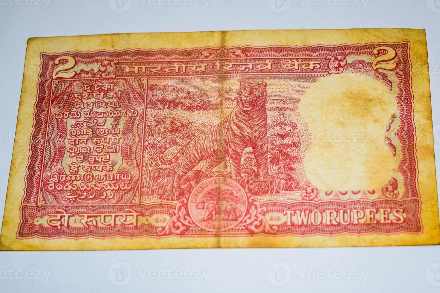 Old Two Rupee notes combined on the table, India money on the rotating table. Old Indian Currency notes on a rotating table, Indian Currency on the table photo