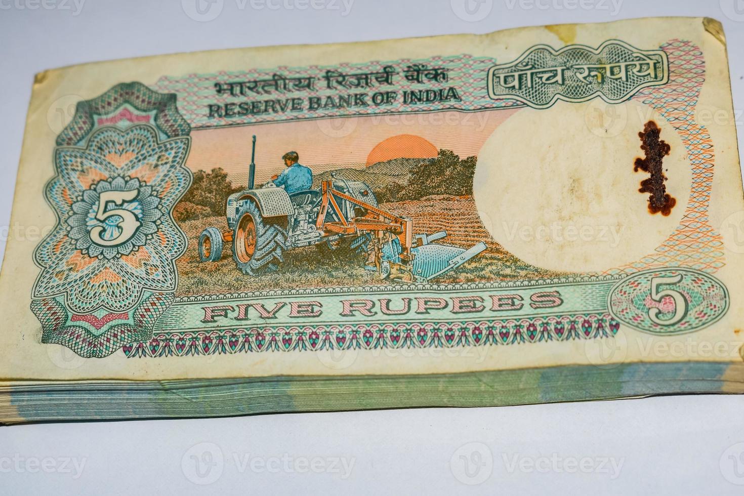 Old Five Rupee notes combined on the table, India money on the rotating table. Old Indian Currency notes on a rotating table, Indian Currency on the table photo
