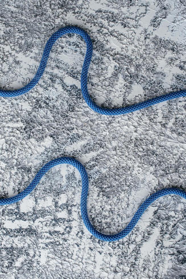 They strong enough, don't worry. Isolated photo of climbing knots. Cables lying on the white and grey colored surface