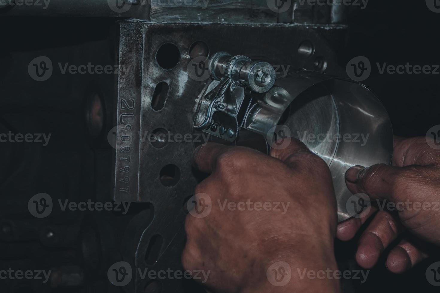 The mechanic is checking the engine. photo