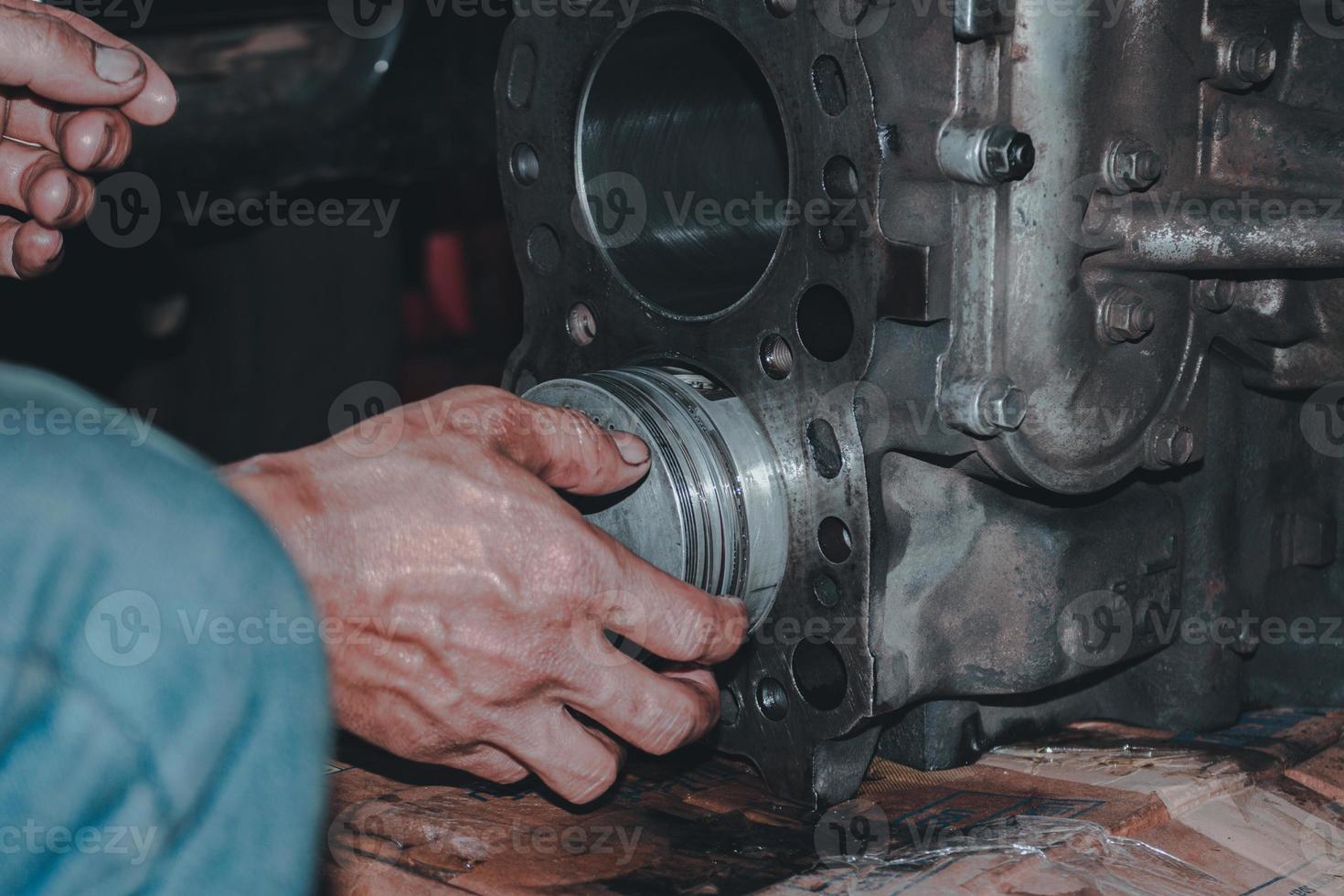 The mechanic is checking the engine. photo