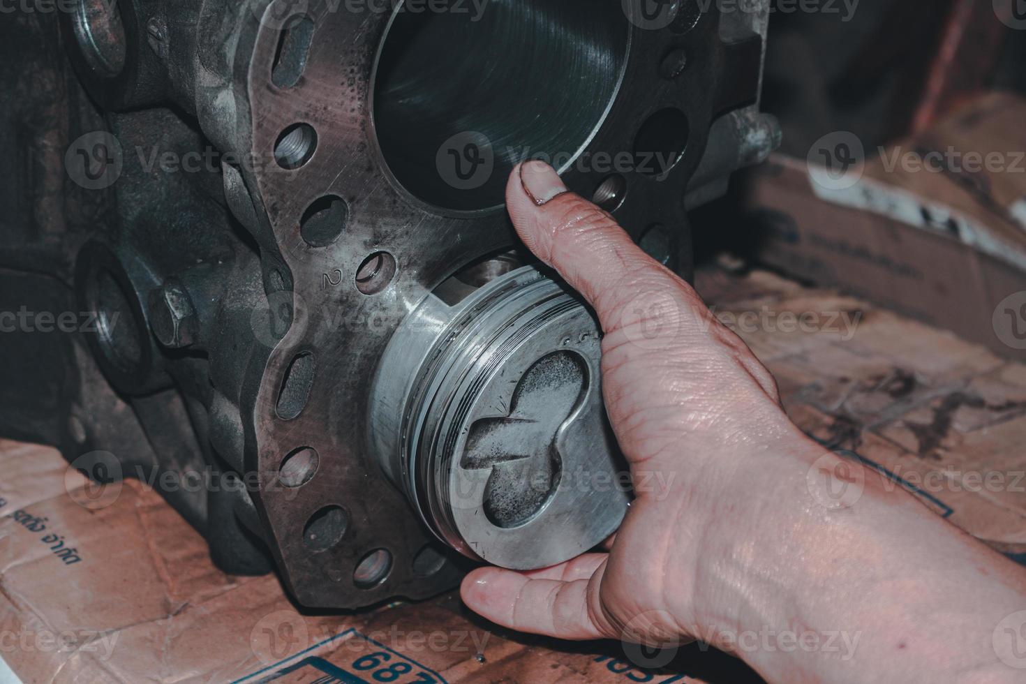 The mechanic is checking the engine. photo