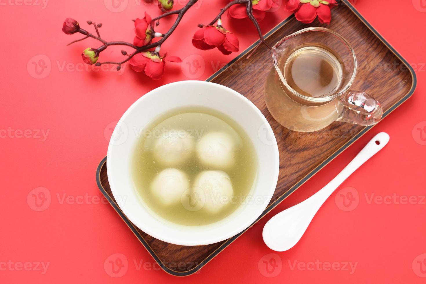 Ronde, Tang Yuan, glutinous rice dumpling balls, is a traditional warm drink made from ginger. The sticky rice balls in wedang ronde usually contain mashed beans and brown sugar. photo