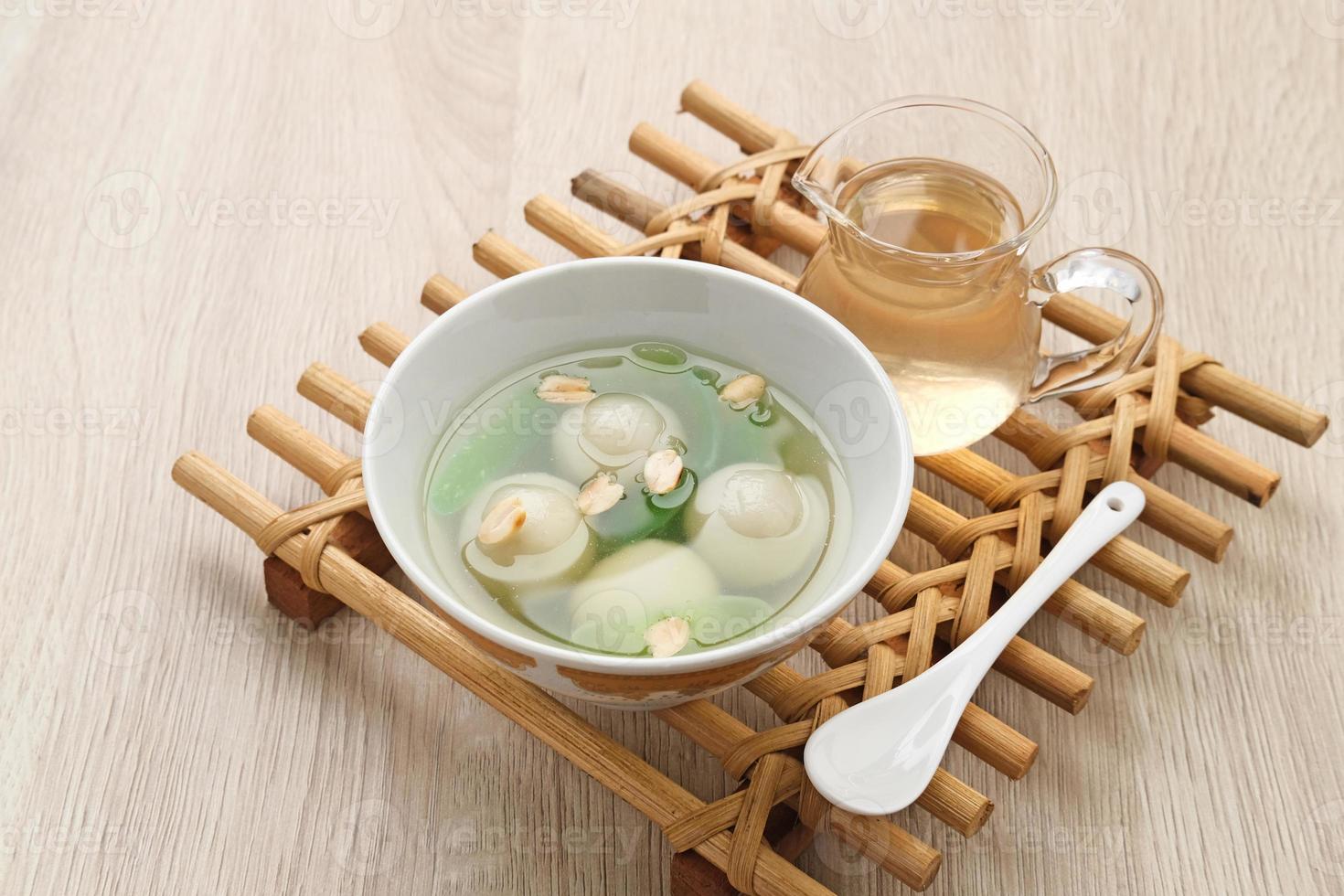 Ronde, Tang Yuan, glutinous rice dumpling balls, is a traditional warm drink made from ginger. The sticky rice balls in wedang ronde usually contain mashed beans and brown sugar. photo