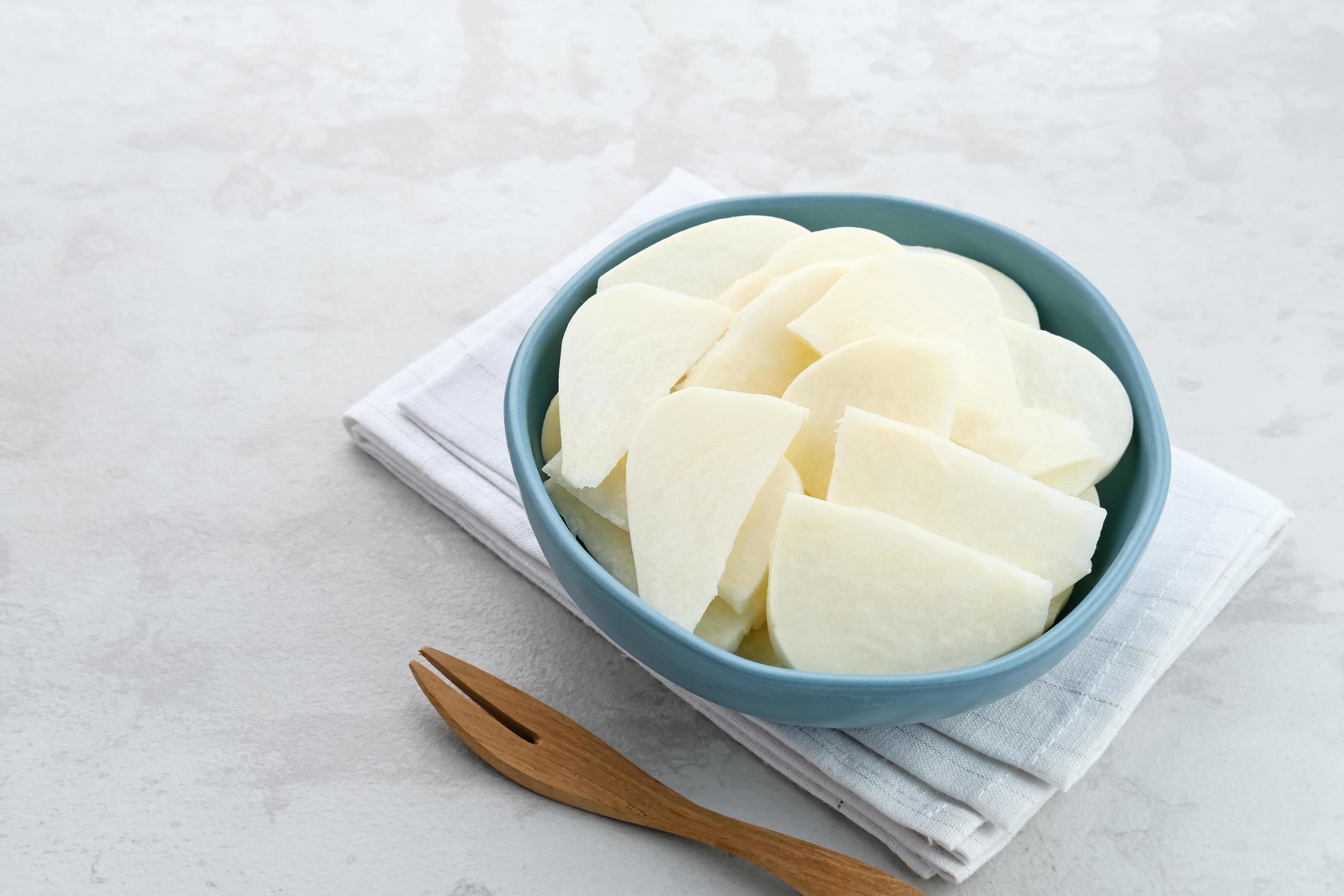 A bowl of fresh jicama or bengkoang, jicama slices, gut health. 8568381