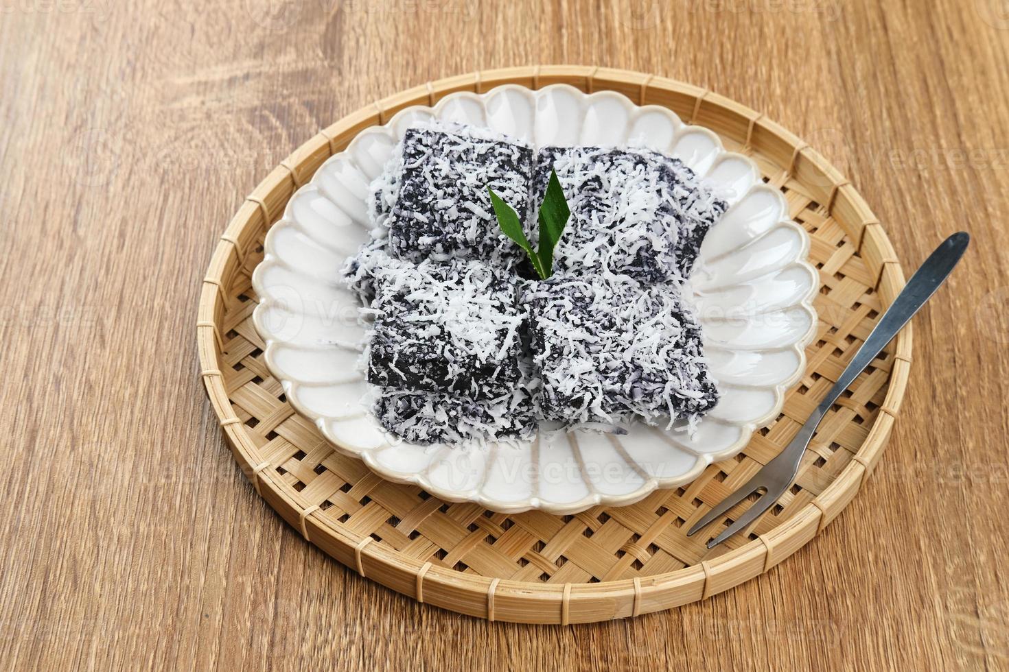 Ongol-Ongol is traditional snacks typical of West Java, Indonesia. Made from sago flour, palm sugar, pandan leaves, and sprinkled with grated coconut. Selected focus. photo