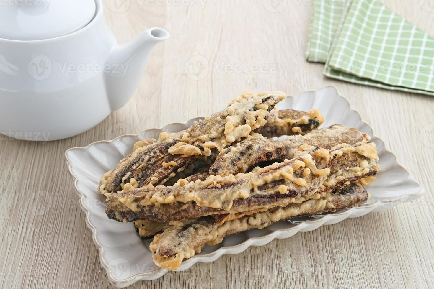 Sale Pisang, Indonesian traditional snack made from bananas that are cut into thin strips, dried in the sun, then fried in flour. photo