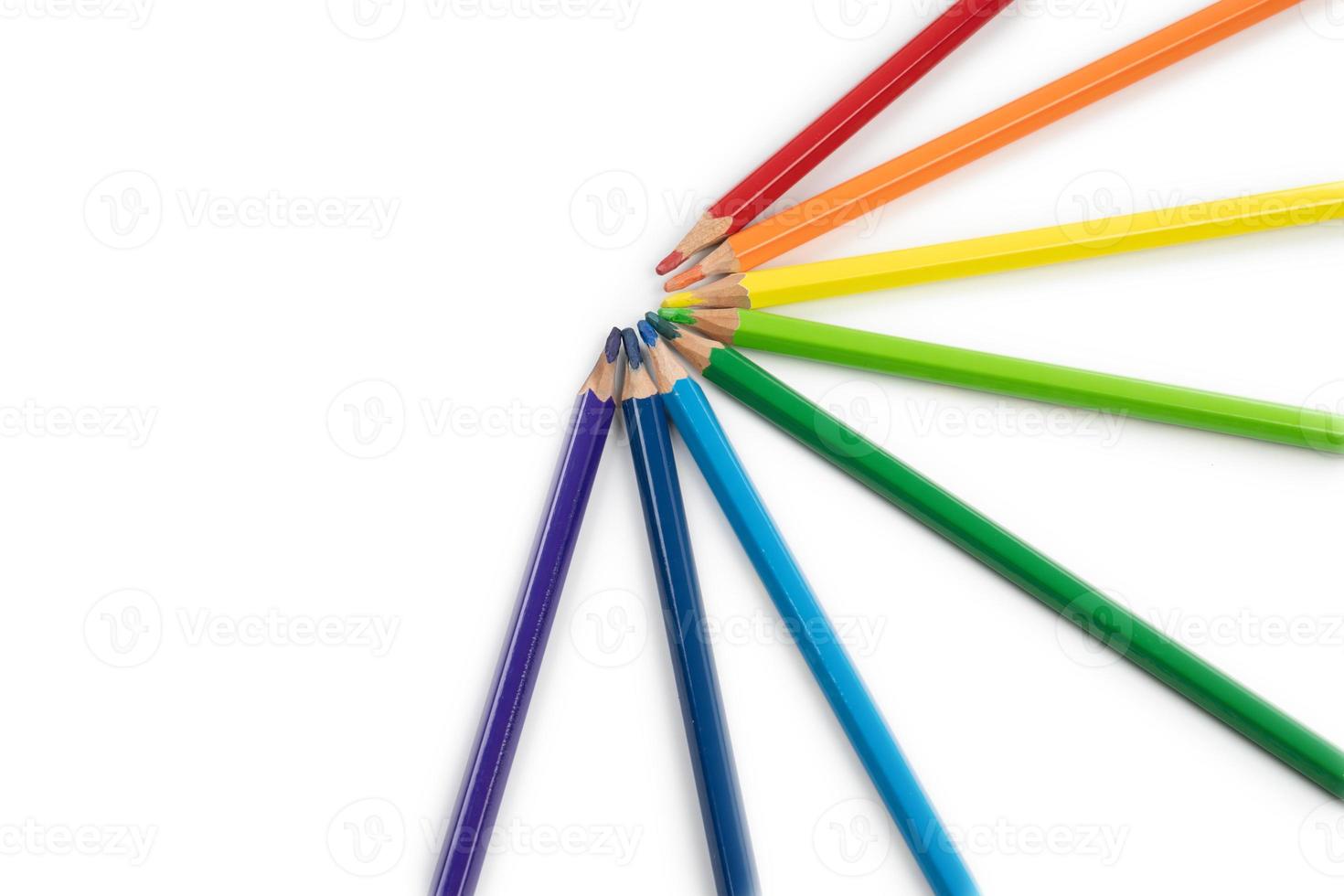 round radius and circle arrangement by blunt colour pencils directed and pointed to the center of the wheel. It has copy space on the white background for any text insertion. photo