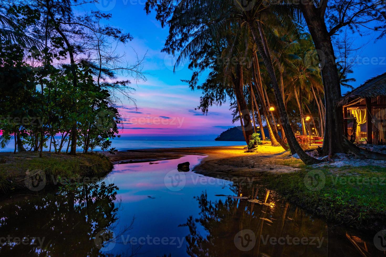Purple violet sky at the beach and sea, in Twilight Time, Koh Kood, Trad province, Thailand. photo