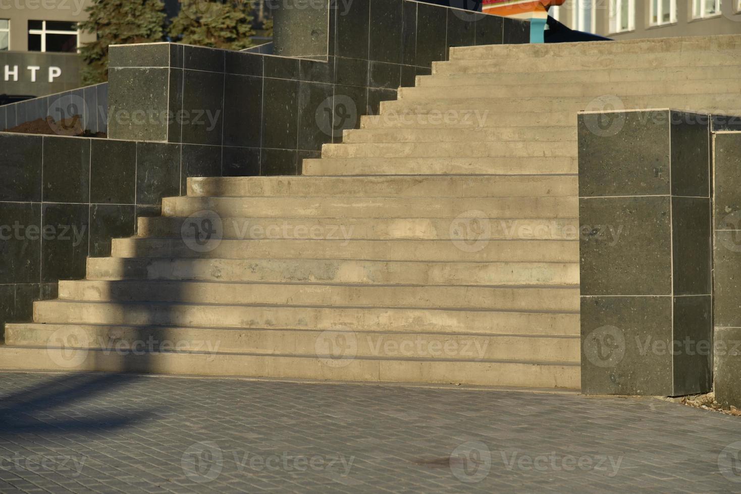 Stone grand staircase in a large building in summer photo