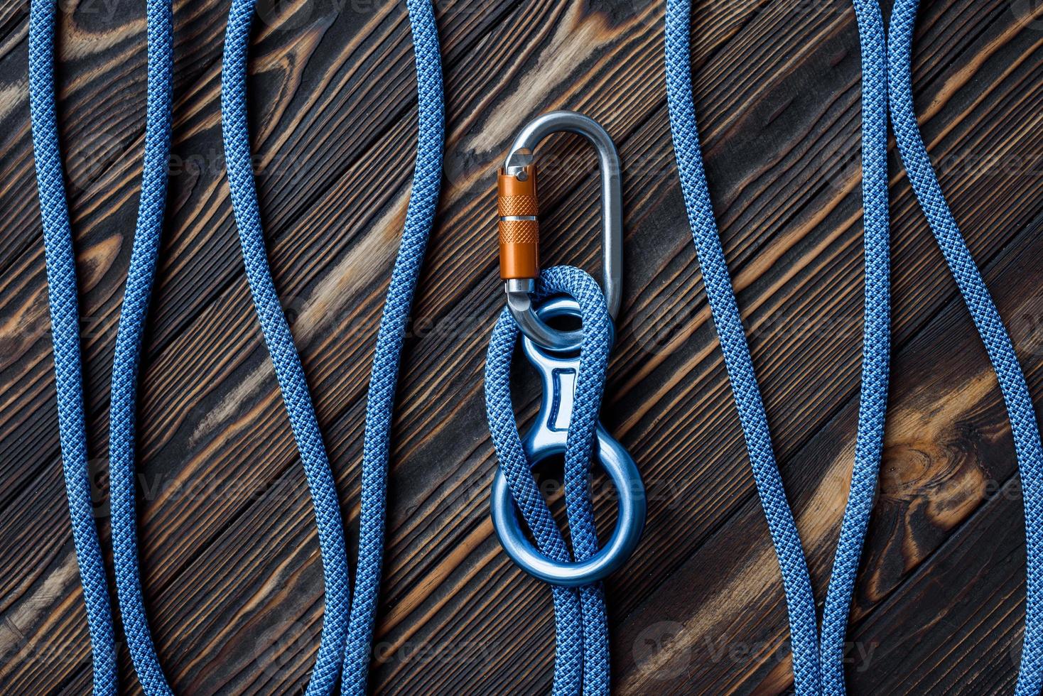 On the wooden table. Isolated photo of climbing equipment. Parts of carabiners
